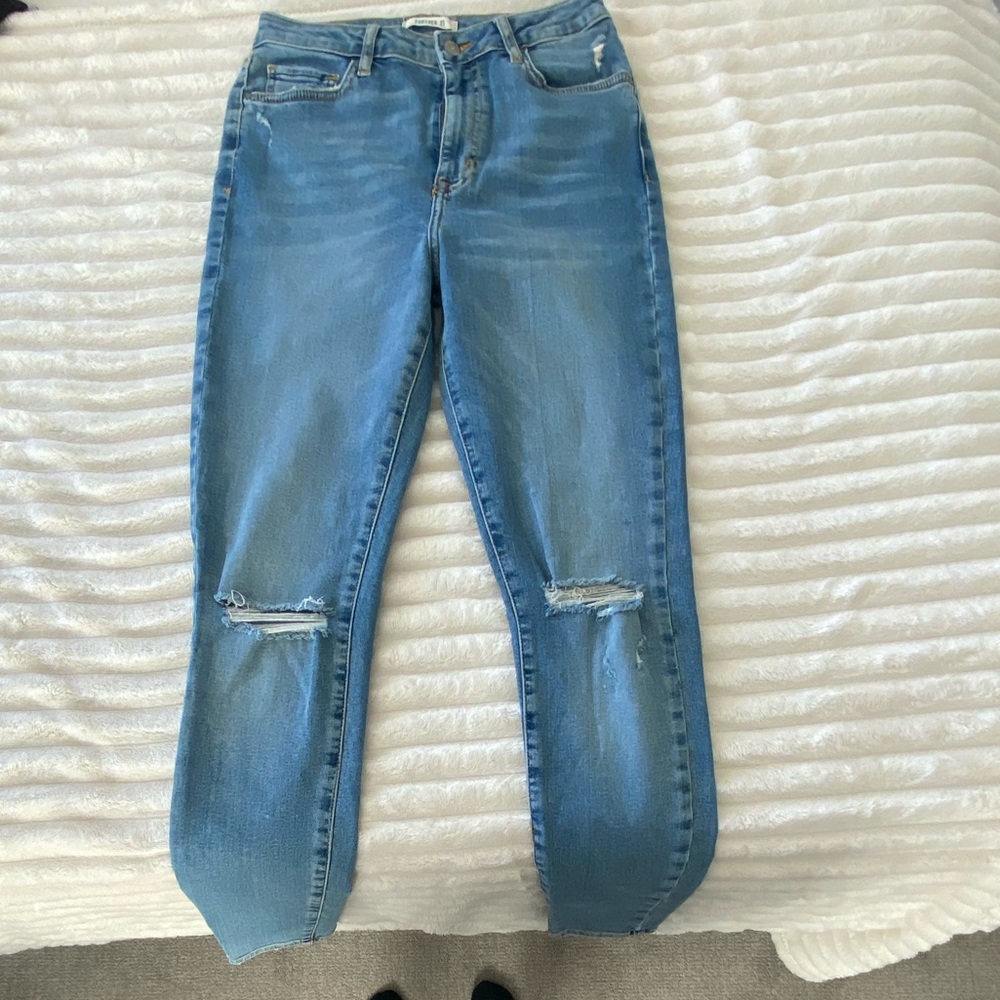 Light wash slightly distressed skinny jeans